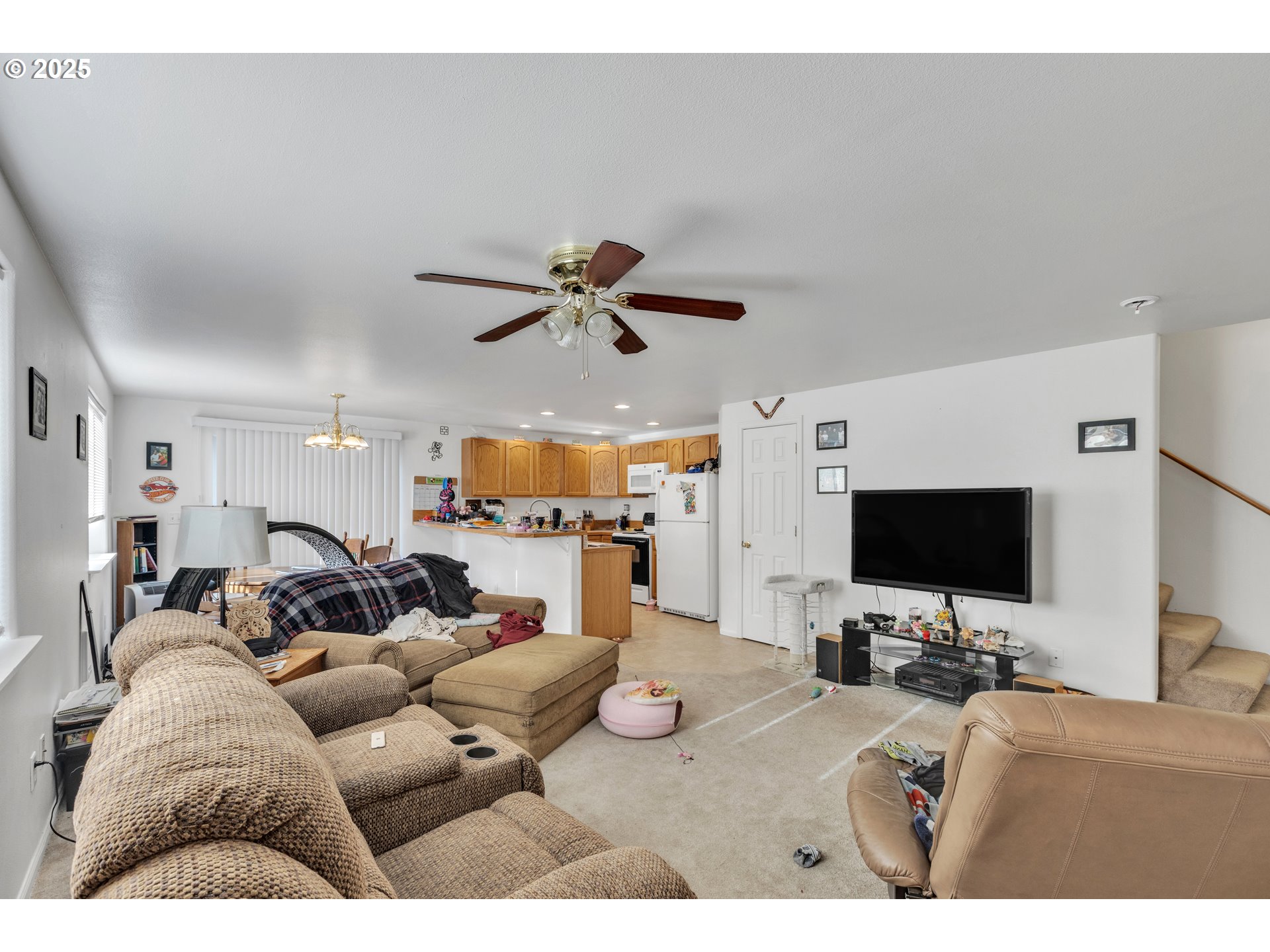 3397 Oak Street Florence, OR 97439 - Photo 4 of 48 a living room with furniture and a flat screen tv