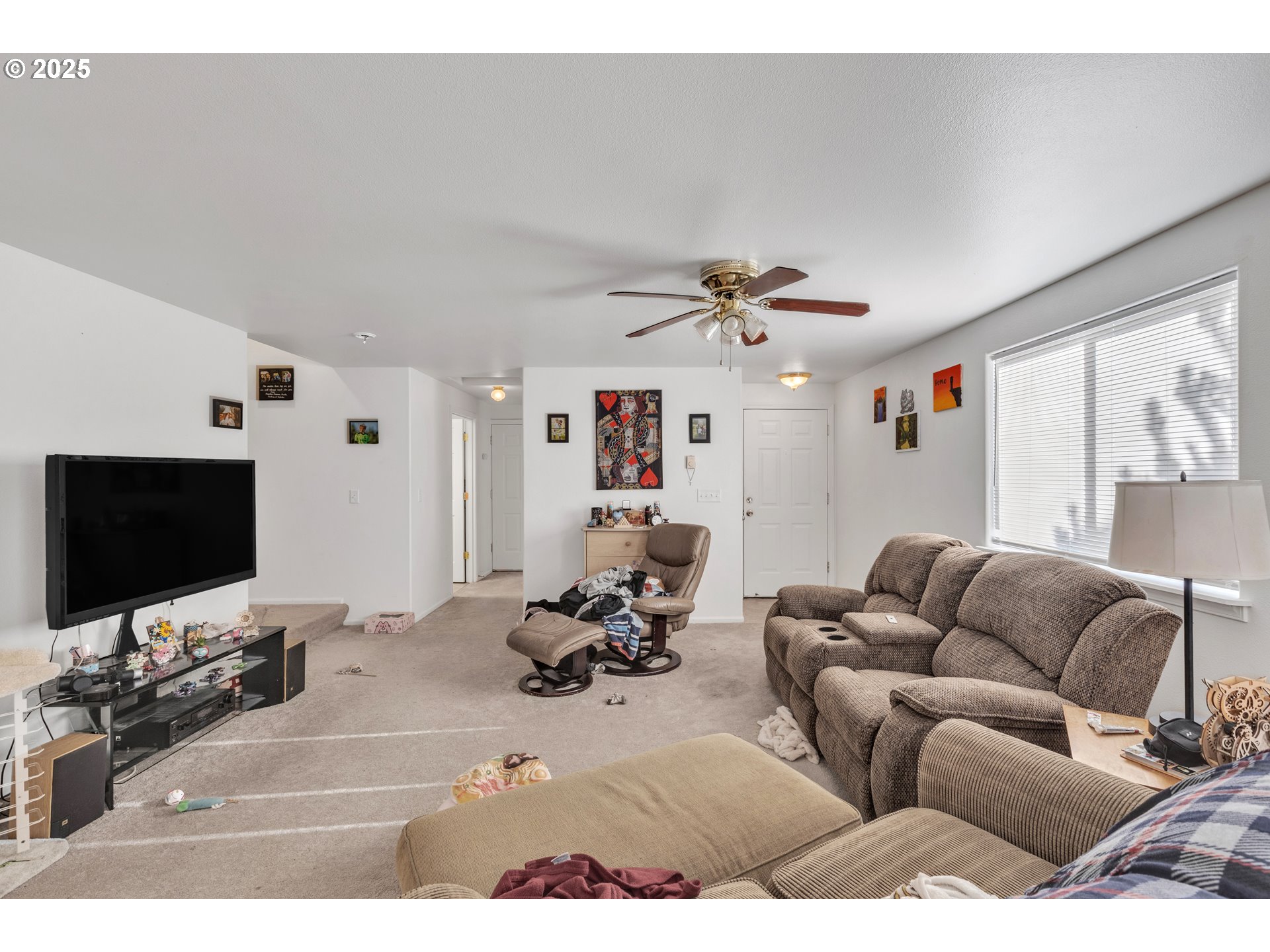 3397 Oak Street Florence, OR 97439 - Photo 5 of 48 a living room with furniture and a flat screen tv