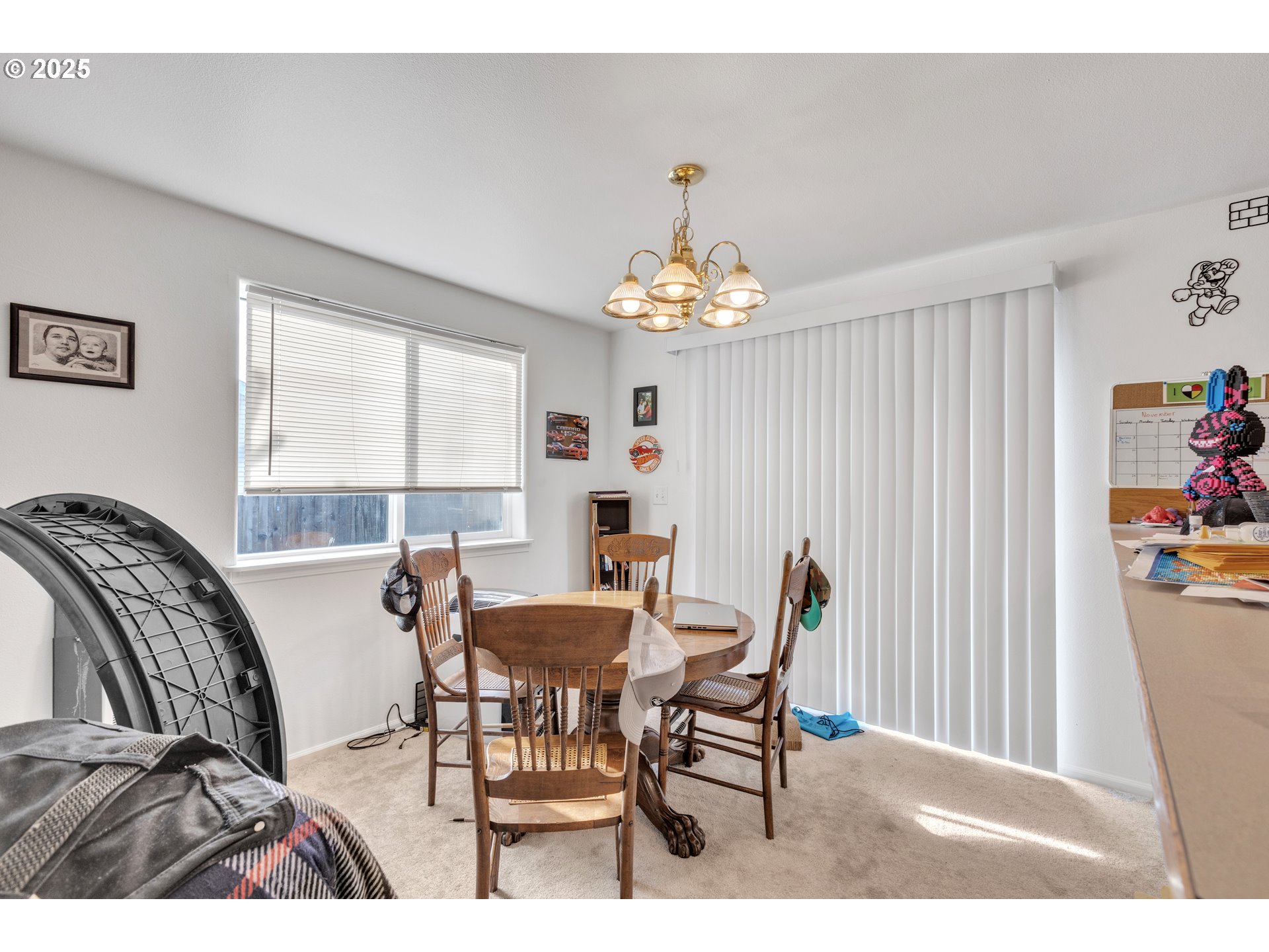 3397 Oak Street Florence, OR 97439 - Photo 8 of 48 a view of a dining room with furniture and chandelier