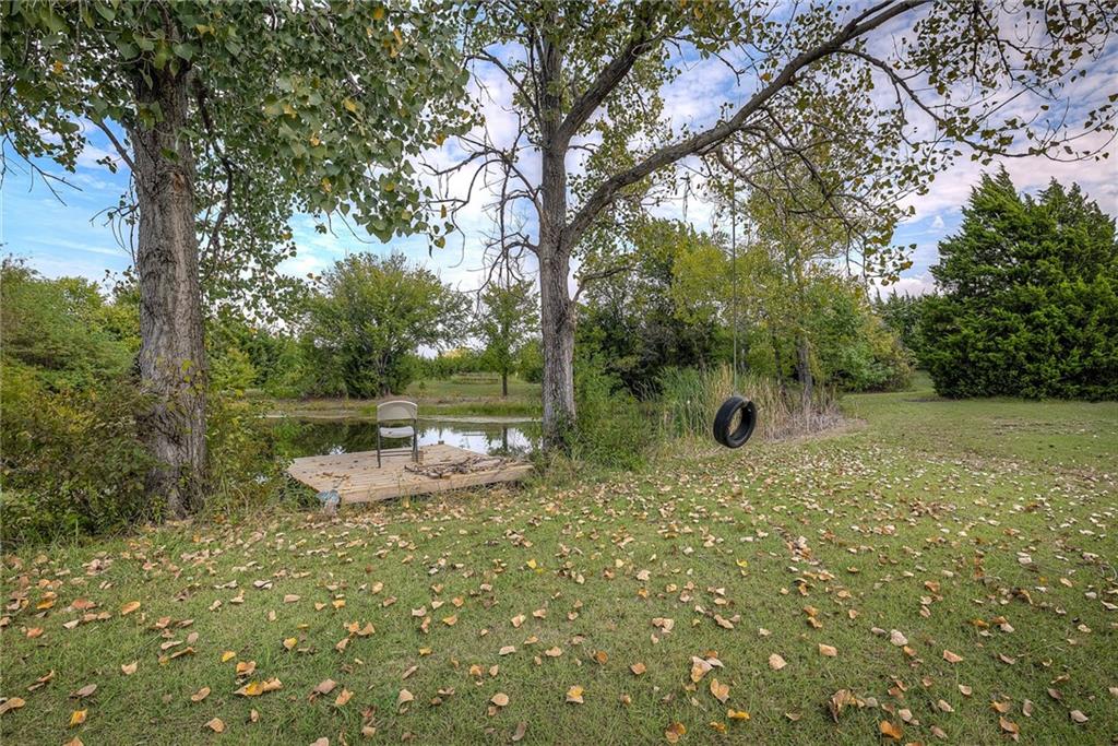 5627 Horizon Road Rockwall, TX 75032 - Photo 22 of 23 a backyard of a house with yard and outdoor seating