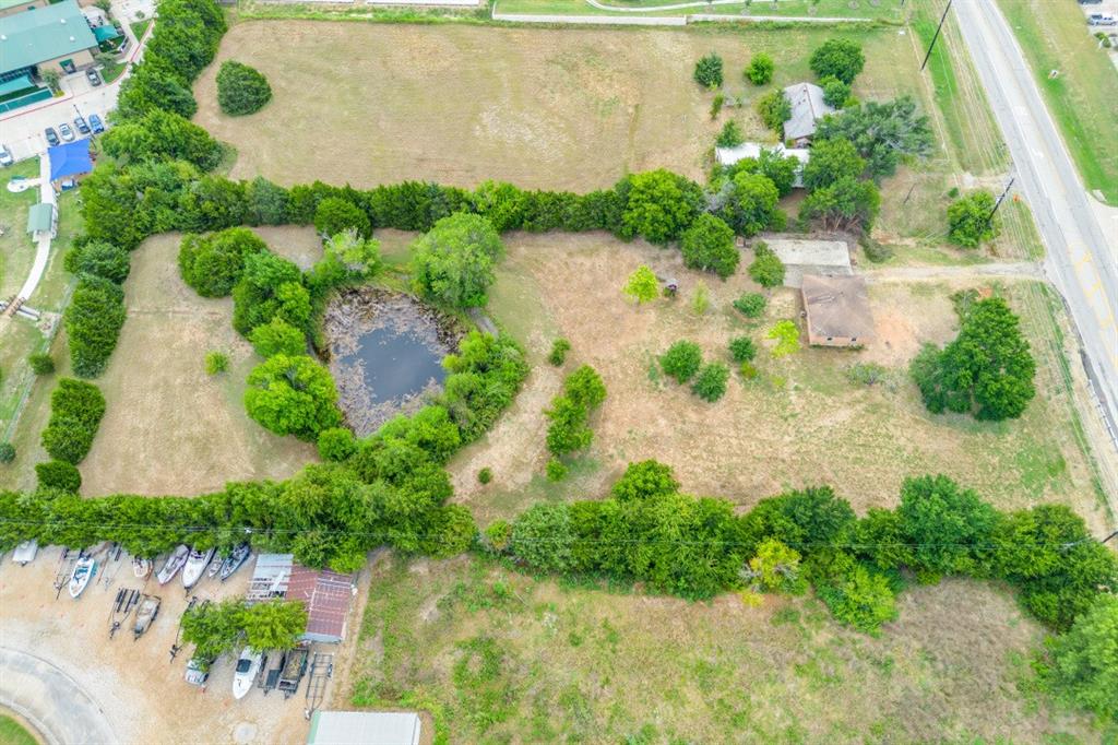 5627 Horizon Road Rockwall, TX 75032 - Photo 4 of 23 an aerial view of a house with a yard and lake view