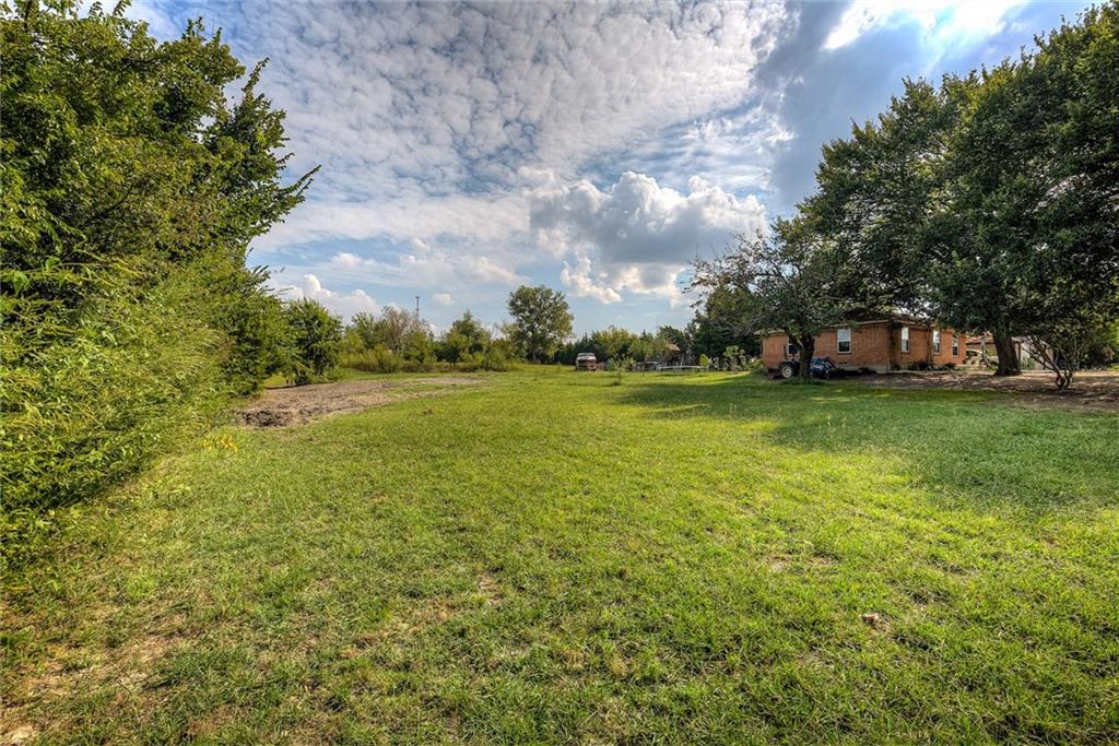 5627 Horizon Road Rockwall, TX 75032 - Photo 5 of 23 a view of a big yard with an trees