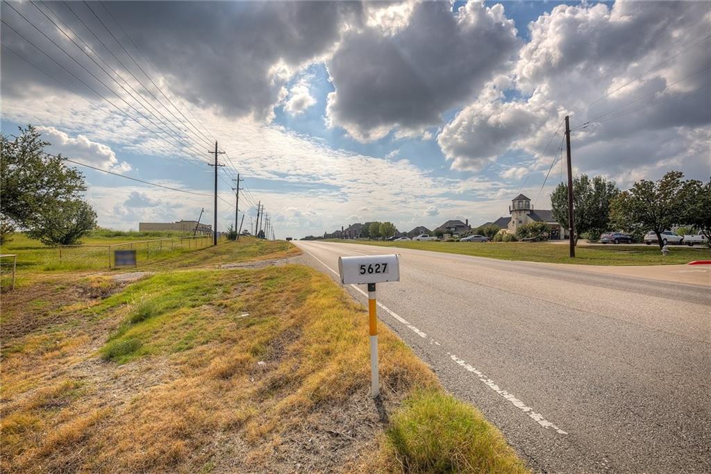 5627 Horizon Road Rockwall, TX 75032 - Photo 10 of 23 a view of a lake with a yard