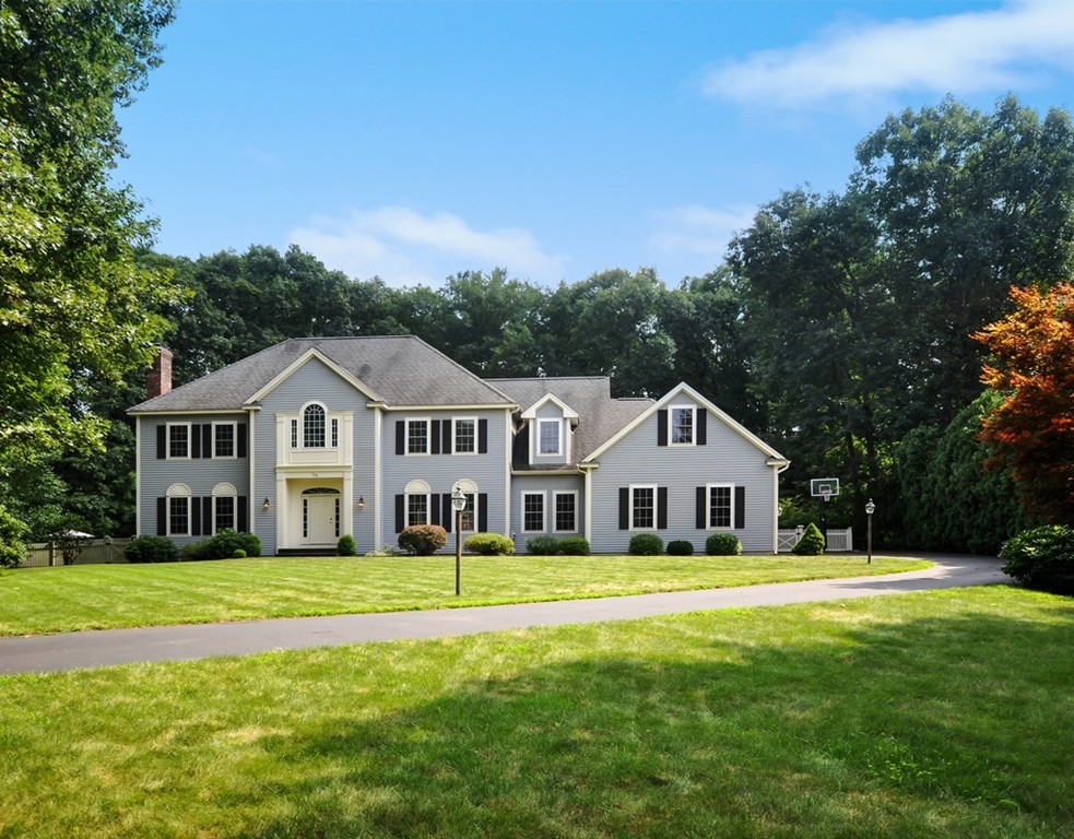 120 Colonial Ridge Drive Boxborough, MA 01719 - Photo 1 of 28 a front view of a house with a garden and yard