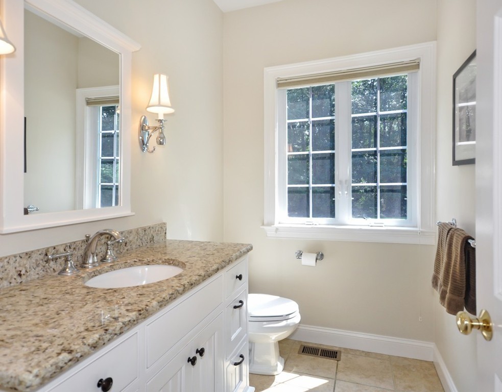120 Colonial Ridge Drive Boxborough, MA 01719 - Photo 16 of 28 a bathroom with a granite countertop sink toilet and mirror