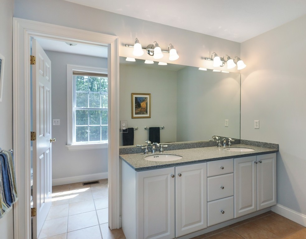 120 Colonial Ridge Drive Boxborough, MA 01719 - Photo 23 of 28 a bathroom with a sink vanity and a mirror