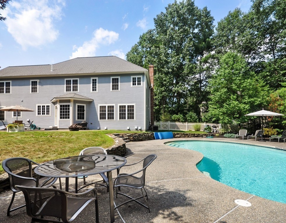 120 Colonial Ridge Drive Boxborough, MA 01719 - Photo 26 of 28 a front view of a house with swimming pool having outdoor seating