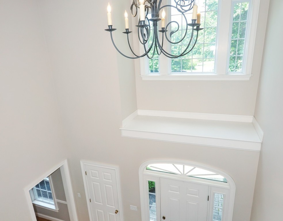 120 Colonial Ridge Drive Boxborough, MA 01719 - Photo 3 of 28 a bathroom with a mirror and a sink