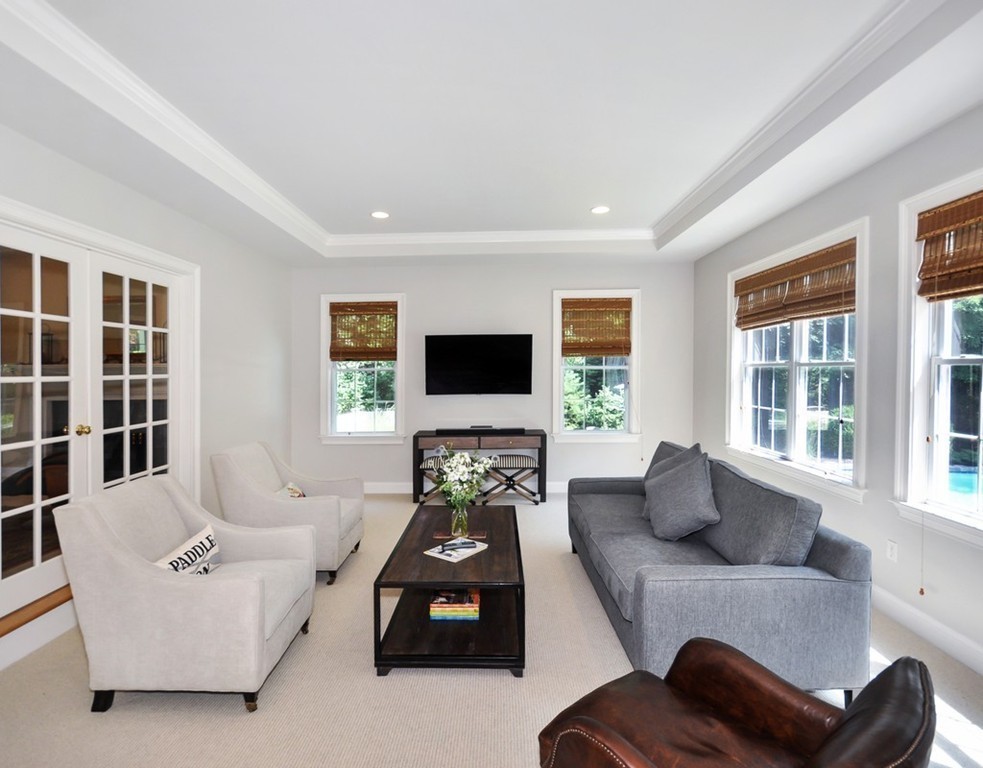 120 Colonial Ridge Drive Boxborough, MA 01719 - Photo 10 of 28 a living room with furniture and a flat screen tv