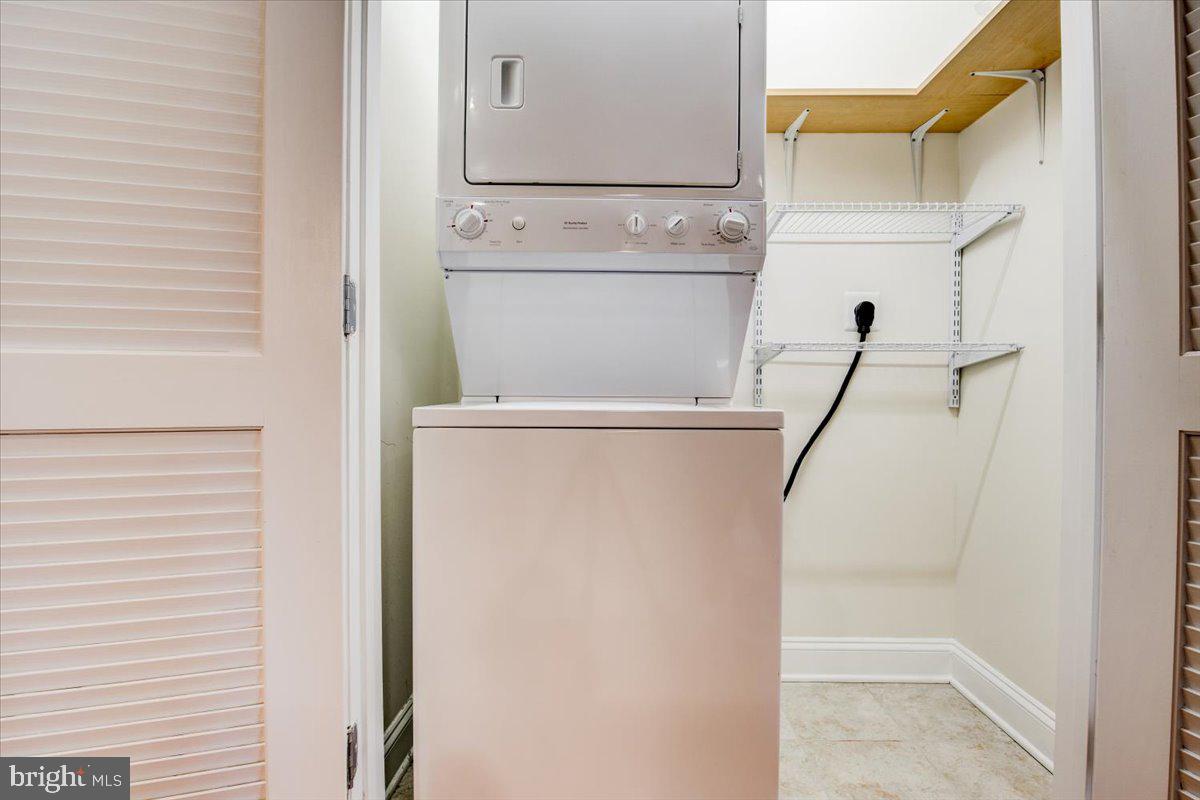1023 North Royal Street, Unit 208 Alexandria, VA 22314 - Photo 16 of 29 a close view of a utility room with dryer and washer