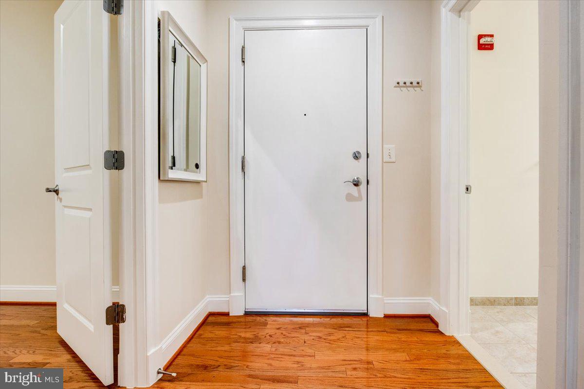 1023 North Royal Street, Unit 208 Alexandria, VA 22314 - Photo 4 of 29 a view of room with window and wooden floor