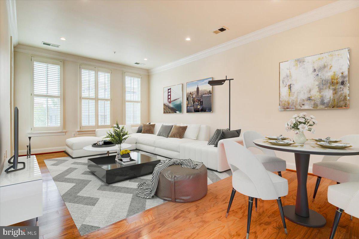 1023 North Royal Street, Unit 208 Alexandria, VA 22314 - Photo 5 of 29 a living room with furniture and large window