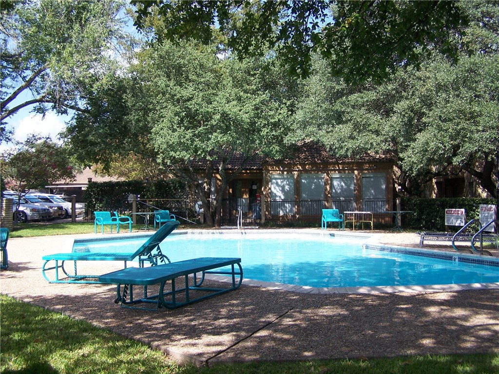 8210 Bent Tree Road, Unit 226 Austin, TX 78759 - Photo 3 of 15 a view of a park with swings