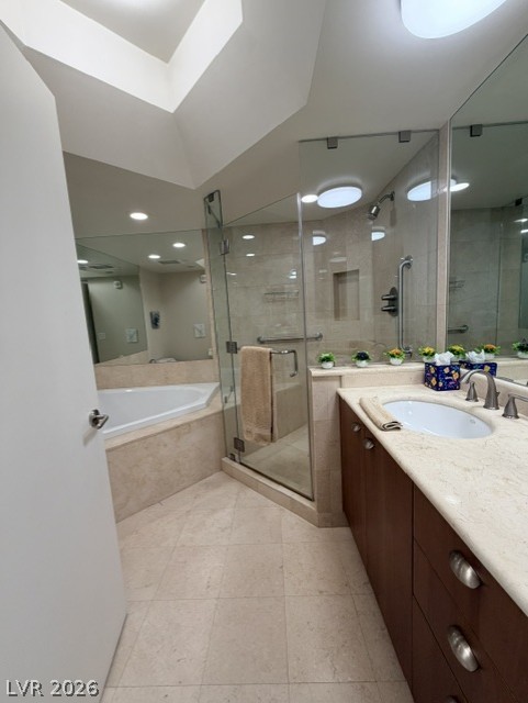 2777 Paradise Road, Unit 807 Las Vegas, NV 89109 - Photo 17 of 61 An inviting primary bathroom featuring a spacious corner tub and a glass-enclosed shower.