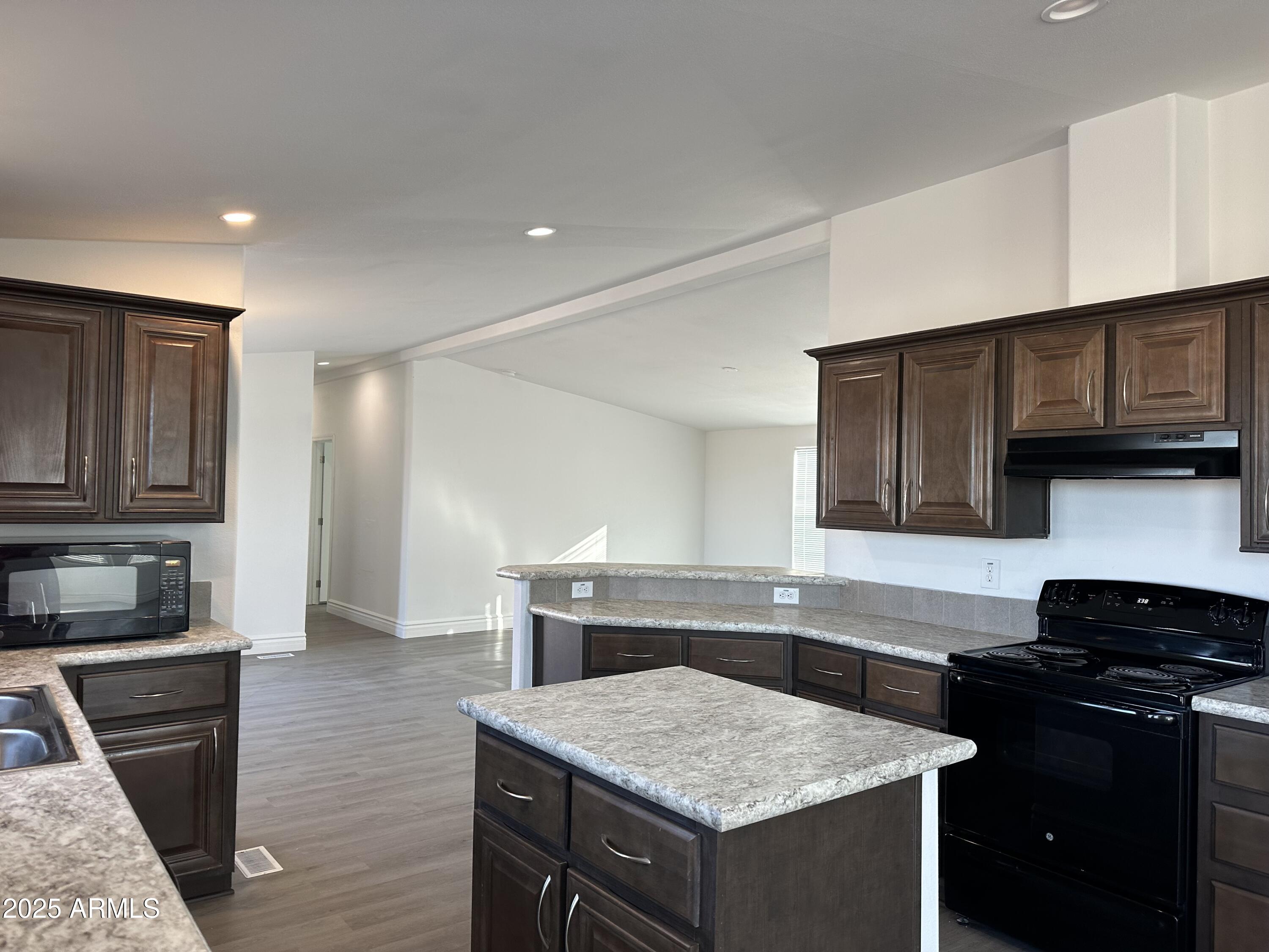38007 West McDowell Road Tonopah, AZ 85354 - Photo 24 of 44 a kitchen with a stove and a sink