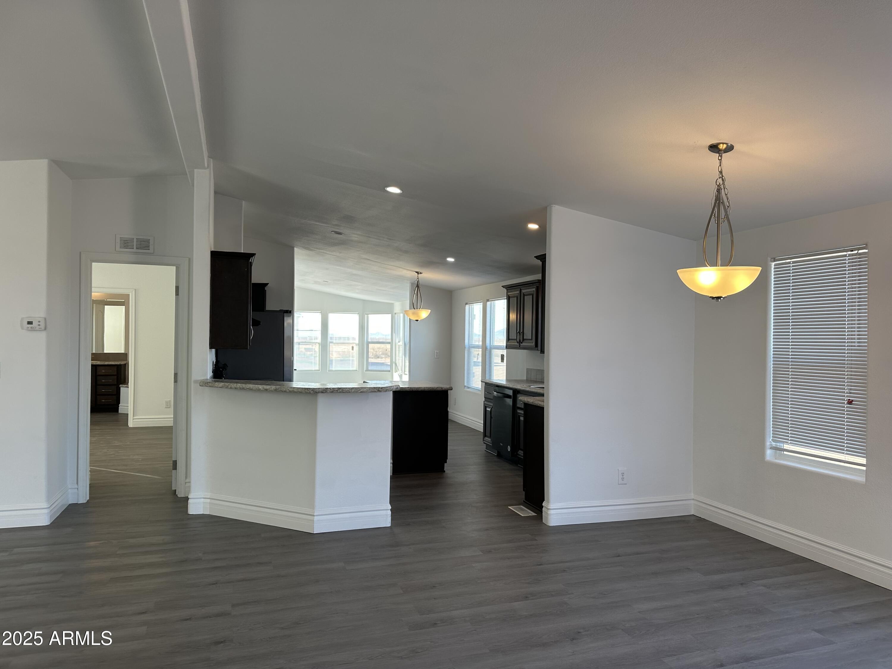 38007 West McDowell Road Tonopah, AZ 85354 - Photo 34 of 44 a view of empty room with wooden floor