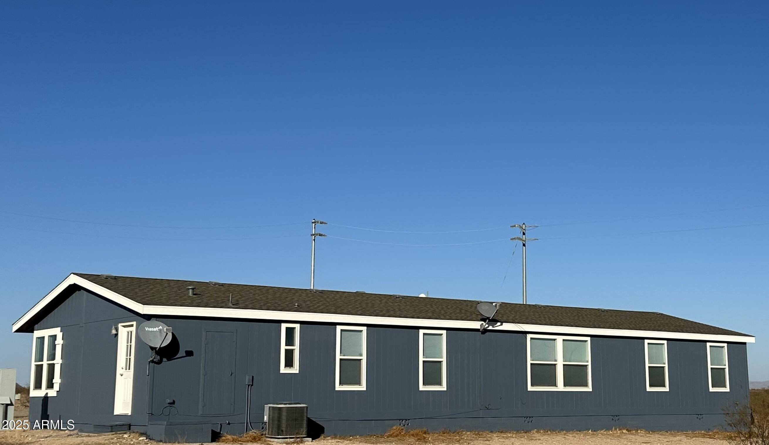 38007 West McDowell Road Tonopah, AZ 85354 - Photo 6 of 44 a front view of a house with a yard