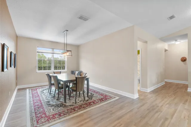 a bed room with a bed and a chair