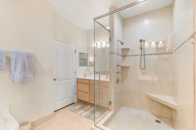 a bathroom with a bathtub and a shower