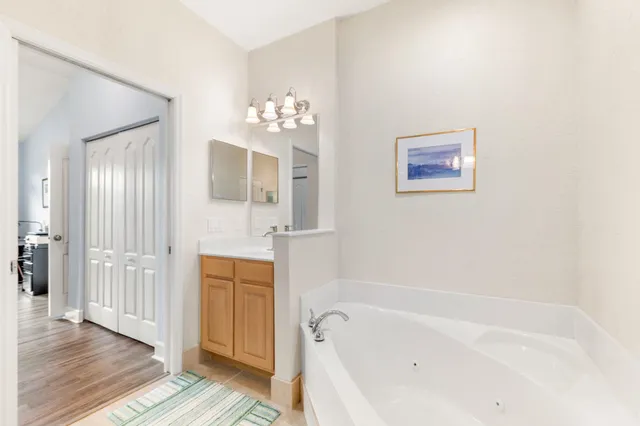 a bedroom with a bed and a lamp