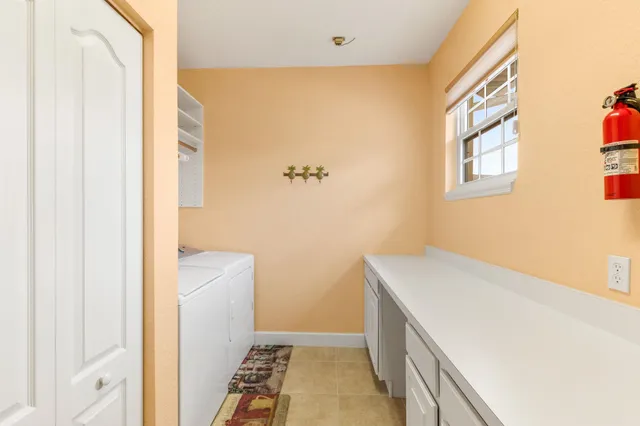 a kitchen with a refrigerator and cabinets