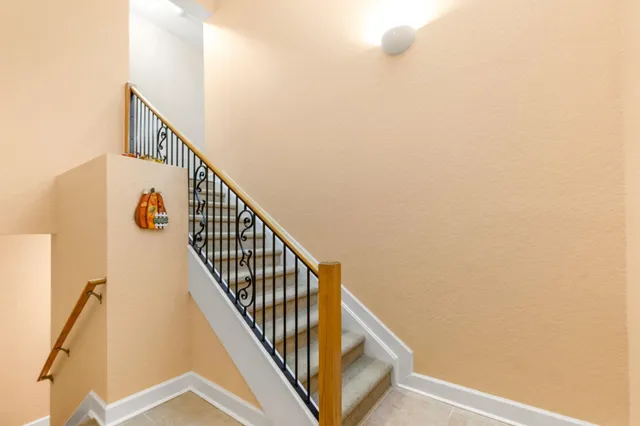 a view of a swimming pool and outdoor seating