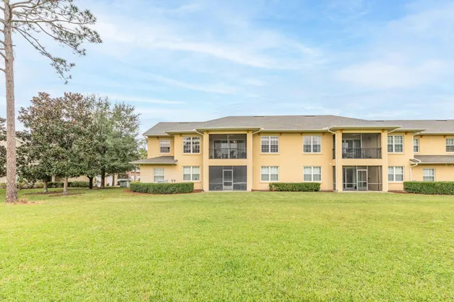 an outdoor space with swimming pool and furniture