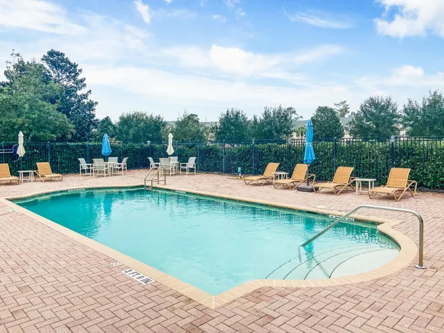 a view of a park with large trees