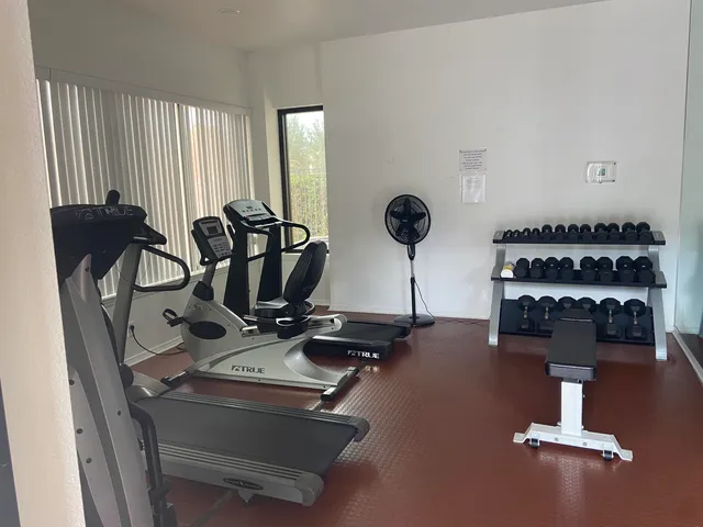 a view of a park with swings and slides