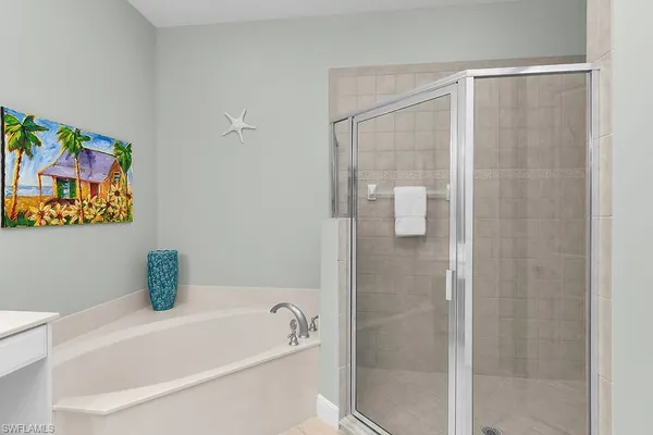 a bathroom with a bathtub and shower