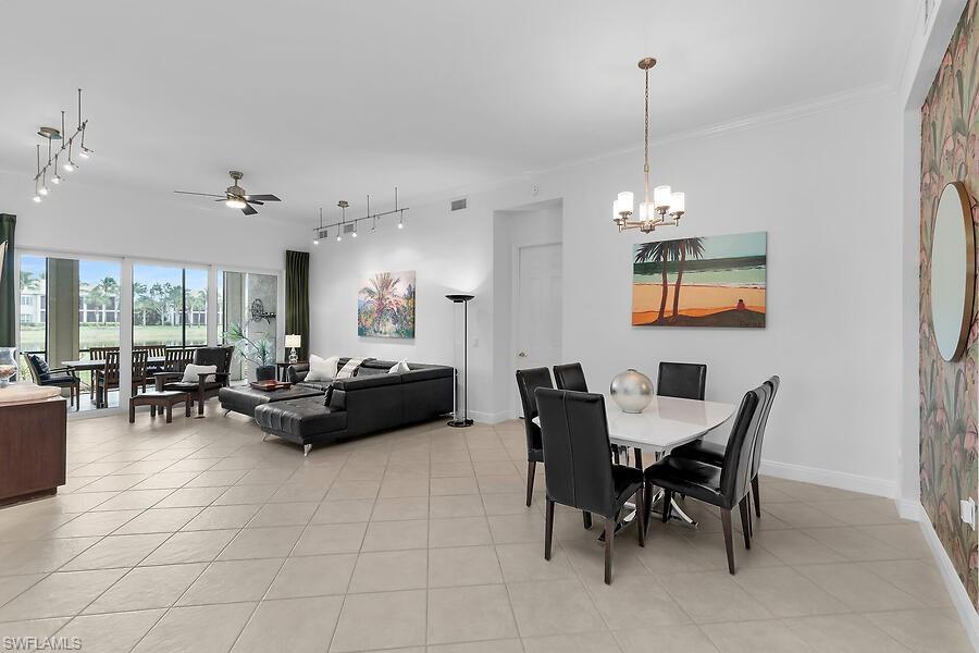 9292 Belle Court, Unit 101 Naples, FL 34114 - Photo 5 of 43 View of Living/Dinind out to lanai