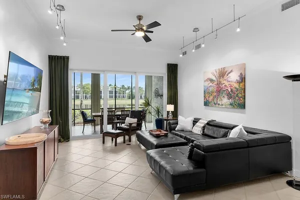 a living room with furniture and a large window
