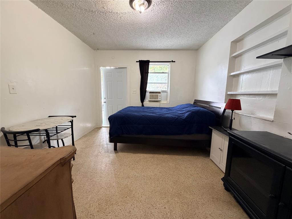 1822 Cleveland Street, Unit 1REAR Hollywood, FL 33020 - Photo 3 of 6 a bedroom with a bed and a window