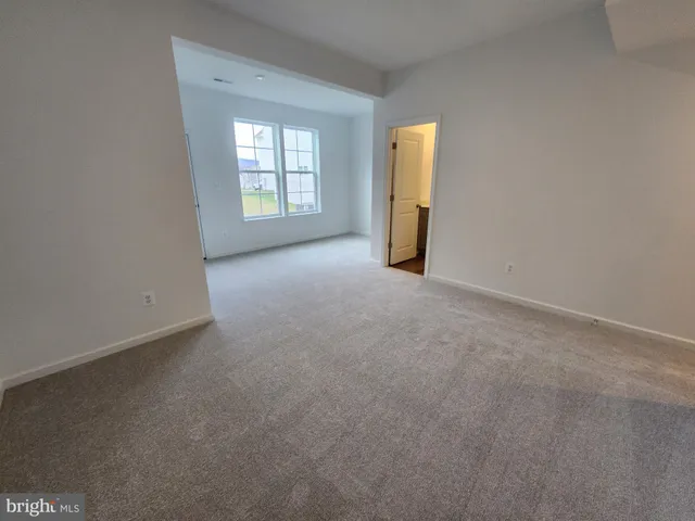 a bathroom with a toilet sink and a mirror