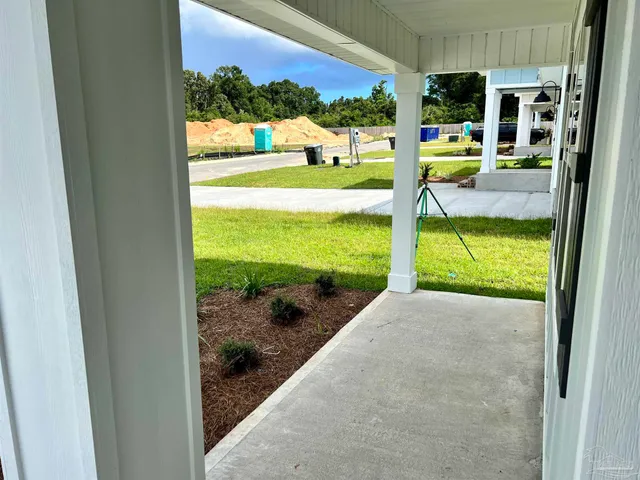 a view of a porch with a yard