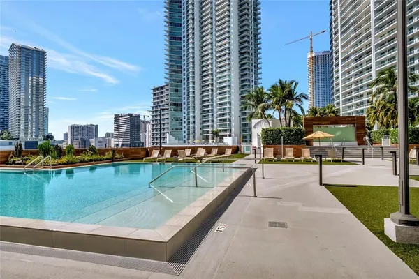 a view of swimming pool from a balcony