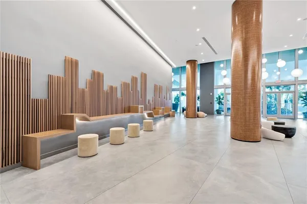 a lobby with furniture and outdoor seating