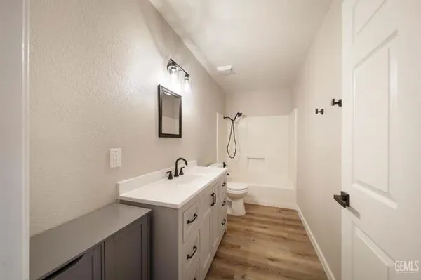 a bathroom with a double vanity sink and mirror