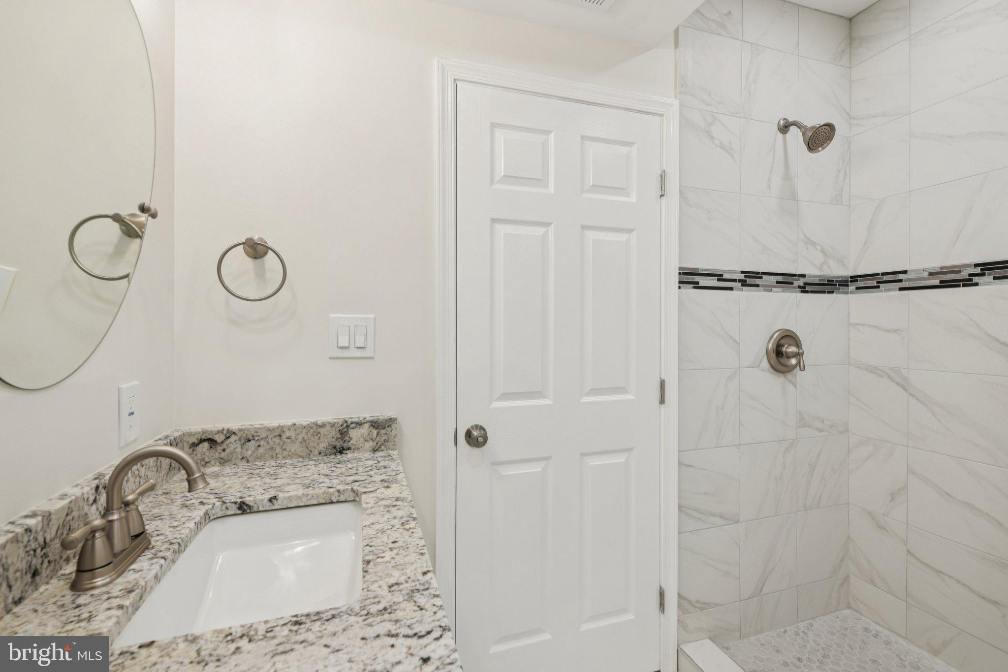 729 Madison Street Northwest Washington, DC 20011 - Photo 24 of 59 a bathroom with a sink a toilet and shower