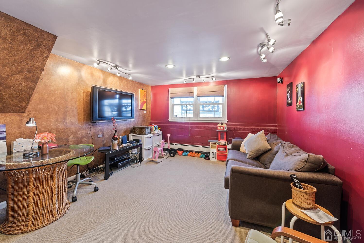 19 Larchmont Road Edison, NJ 08837 - Photo 14 of 30 a living room with furniture and a flat screen tv