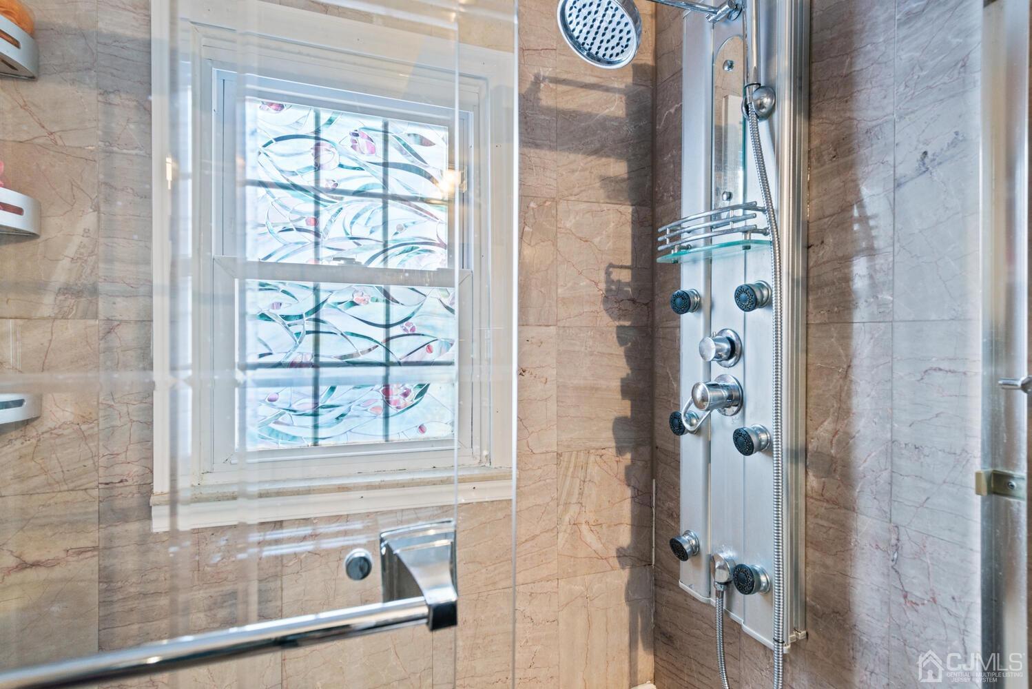 19 Larchmont Road Edison, NJ 08837 - Photo 22 of 30 a bathroom with a granite countertop shower and a sink