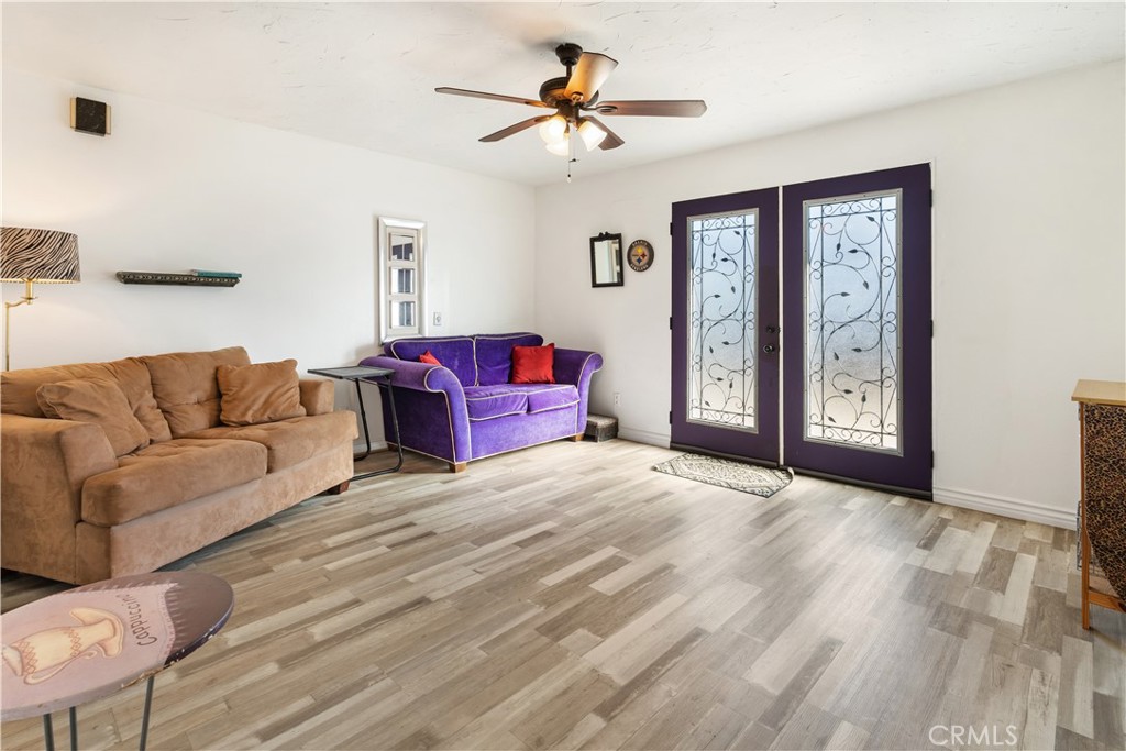 766 South 6th Street Grover Beach, CA 93433 - Photo 6 of 20 a living room with furniture and a ceiling fan