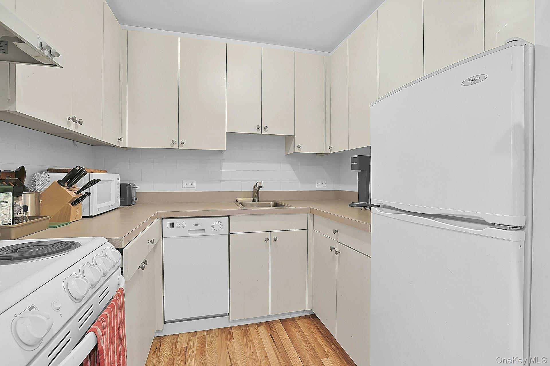 20 Nazareth Way Cold Spring, NY 10516 - Photo 42 of 50 The cottage kitchen is a cozy and convenient space. Nearby, there is a full bathroom and a washer/dryer as well.