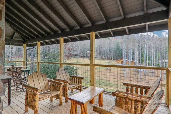 a roof deck with table and chairs