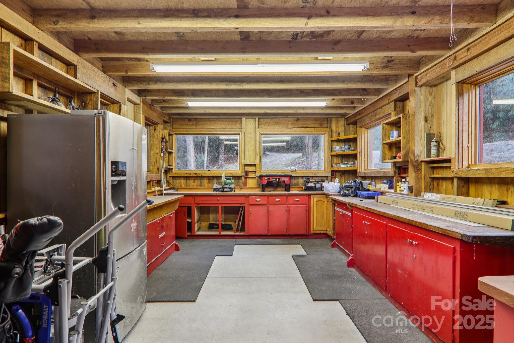 408 Little Elbow Mountain Road Lake Toxaway, NC 28747 - Photo 31 of 48 a large kitchen with stainless steel appliances granite countertop a large stove a sink and dishwasher