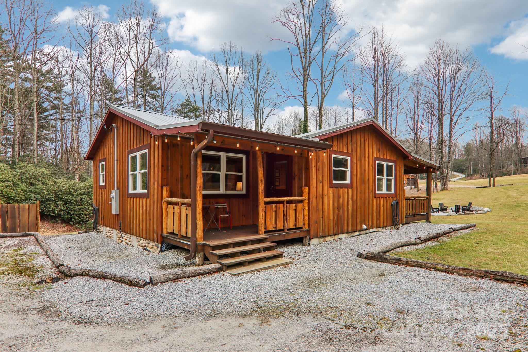 408 Little Elbow Mountain Road Lake Toxaway, NC 28747 - Photo 38 of 48 a view of a house with a yard covered in snow