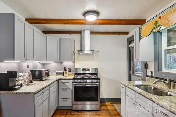 a kitchen with a refrigerator and a sink