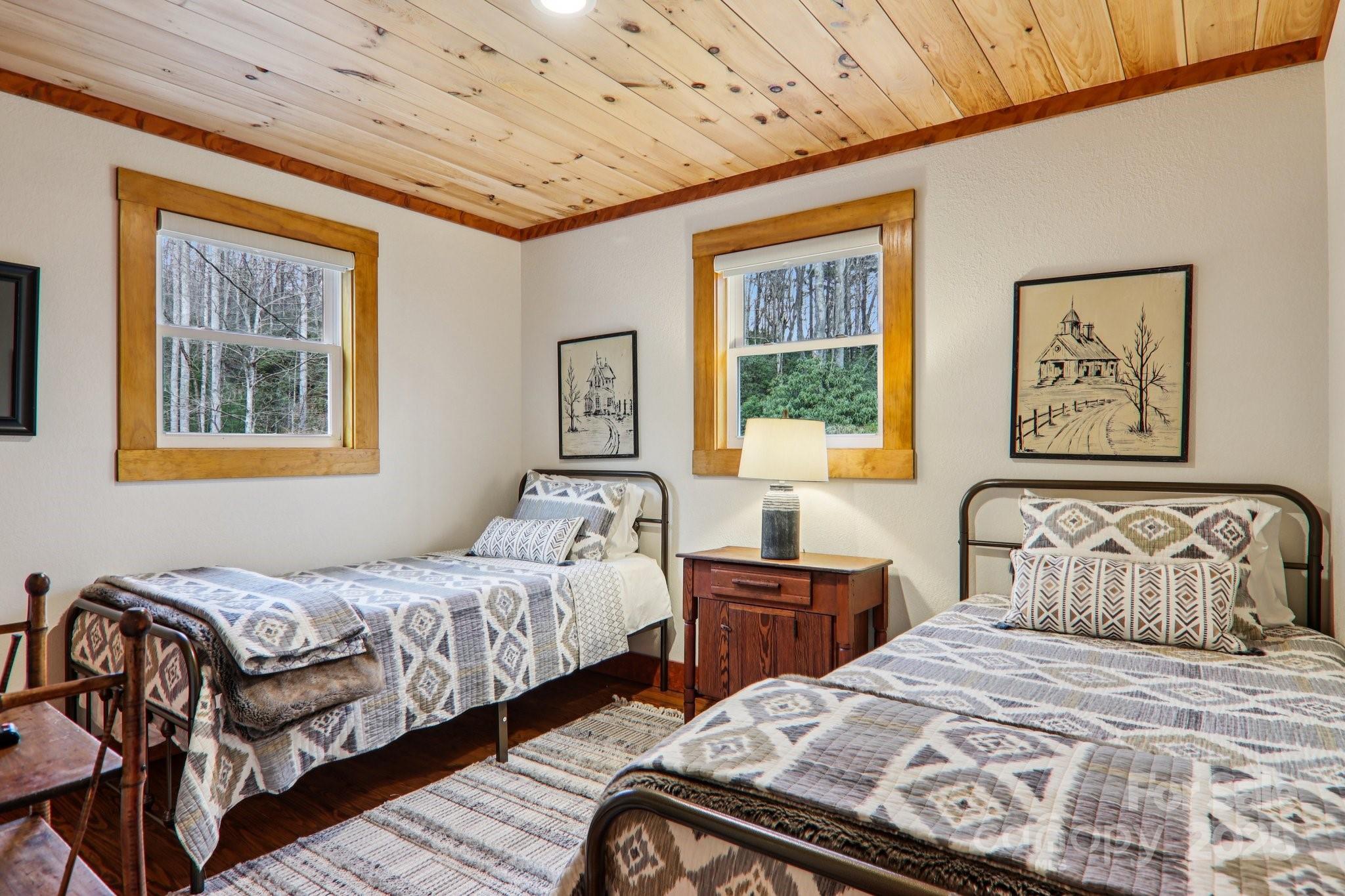 408 Little Elbow Mountain Road Lake Toxaway, NC 28747 - Photo 44 of 48 a bedroom with double bed and a window