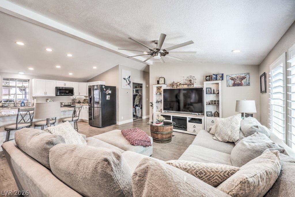 4375 Pinwheel Street Logandale, NV 89021 - Photo 16 of 52 An inviting gathering space, showcasing an open-concept layout with a well-appointed kitchen nearby.