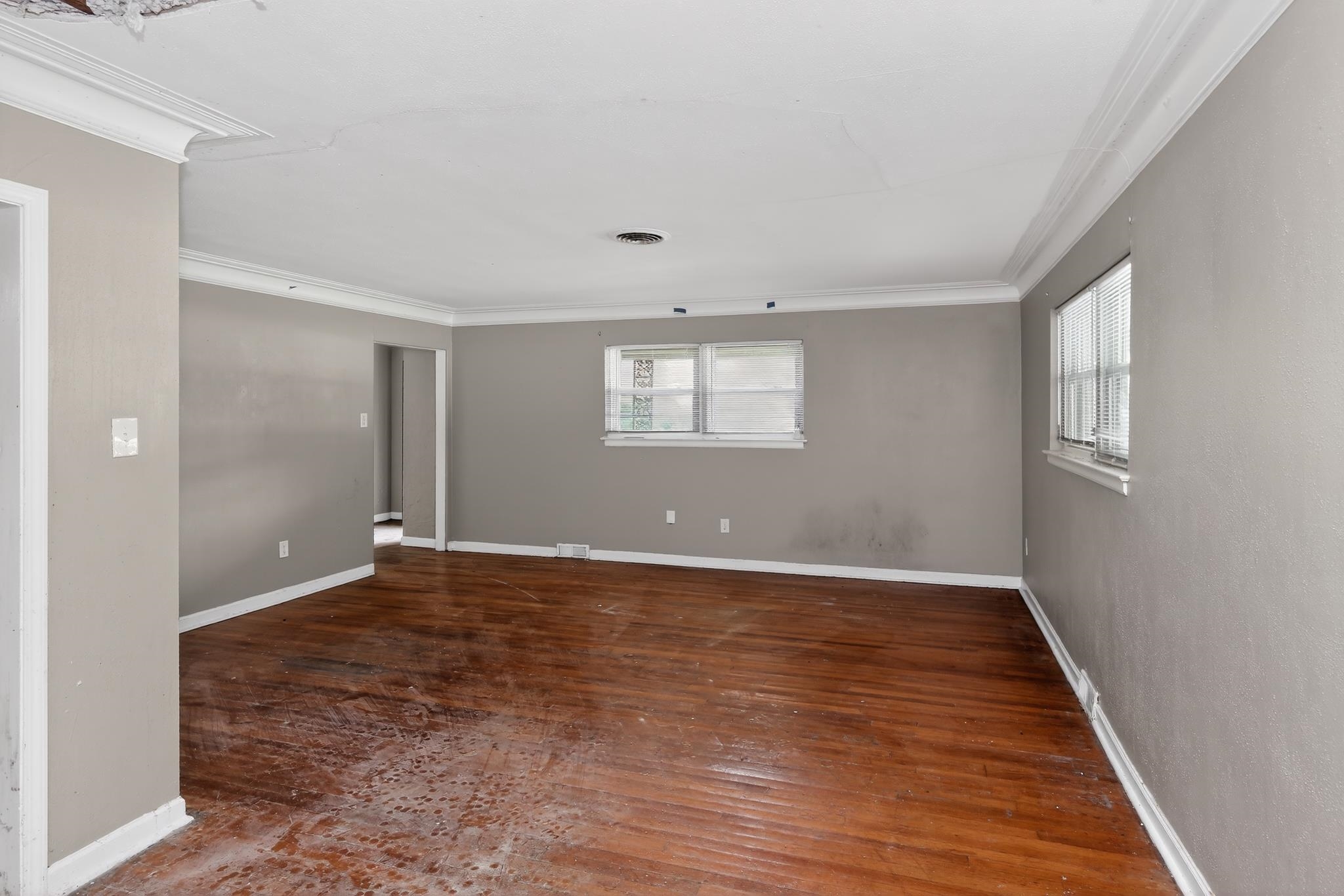 1403 Old Hickory Road Memphis, TN 38116 - Photo 9 of 31 Spacious interior room featuring wood-finish flooring, two windows, and crown molding